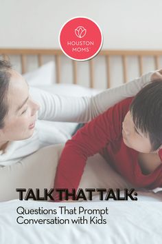 a woman laying on top of a bed next to a child