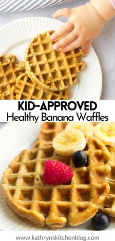 a child's hand reaching for a waffle on top of a white plate