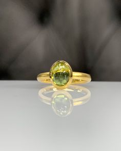 Natural Peridot Ring * Dainty Cabachon Ring * Genuine Peridot & 14K Solid Gold * Best Gift for Her/Him * Handmade Ring ◎ Details ◎ ○ Gemstone Details .Natural PERIDOT Oval Cut 9X7 mm approx. 2.01 ct ○ Gold Details 14K Solid Gold Width of Band : 2.50 mm Weight of Ring : approx 3.80 gr Made to Order HANDMADE ITEM ○ Upgrade to Solid 18K Gold, please click the link below: https://www.etsy.com/listing/962826004 For more CABACHON BEZEL rings : http://etsy.me/37fvI60 ○ PERIDOT RINGS : https://etsy. Luxury Gold Oval Cabochon Gemstones, Yellow Gold Oval Gemstone For Anniversary, Gold Sapphire Ring Oval Cabochon With Polished Finish, Luxury Oval Yellow Gold Gemstones For Anniversary, Oval Yellow Gold Gemstones For Anniversary, Gold Round Gemstones For Anniversary, Classic Yellow Gold Sapphire Ring Oval Cabochon, Heirloom Yellow Gold Emerald Cabochon Ring, Classic Oval Cabochon Sapphire Ring With Bezel Setting