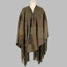 Ralph Lauren 2016 Collection 'Carlotta' Poncho Comes In A Olive & Brown Wool Featuring Patchwork Designs, Suede Fringe Trim, And A Open Front. Excellent Pre-Owned Condition. Marked: Xs/S Measurements: Length: 42 Inches Sui Generis Reference: 115094 Category: Coat More Details Brand: Ralph Lauren Gender: Female Size: S Color: Olive Color 2: Brown Fabric: Wool Material: Mixed Fabrics Pattern: Patchwork Type Of Leather: Suede Style: Fringed Age Group: Adult Sui Generis Designer Consignment Is An Award Winning Fashion Resale Store For Women & Men. Located In San Francisco. The New York Times, Gq, Refinery29, Goop, Forbes And More Have Recognized Sui Generis A Ralph Lauren 2016, Patchwork Poncho, Suede Style, Resale Store, Suede Fashion, Suede Fringe, Brown Fabric, Consignment Stores, Olive Color