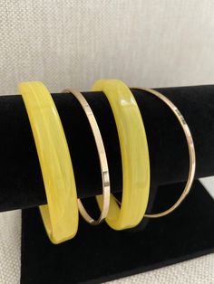 Versatile Yellow + Gold Plated 4 Piece Women's Bracelet Set Mix and Match Yellow Resin + Gold Plated 4 Piece Bangle Includes 2 Yellow Bangles & 2 Gold-Plated Bangles Yellow Resin Statement Gold Bangles Gift For Her Internal Diameter: 2.6 Inches Wide (Fits Most) Ships Free From A Small Business in Texas Adjustable Yellow Bracelets For Party, Adjustable Yellow Round Bangle, Elegant Adjustable Yellow Bangle, Adjustable Yellow Round Bracelets, Trendy Yellow Bangle Bracelets, Trendy Yellow Bangle Bracelet, Trendy Yellow Bracelet Jewelry, Trendy Adjustable Yellow Jewelry, Yellow Bangles