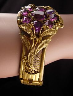 If you love Purple rhinestones in old jewelry then you will love these two pieces. The bracelet has such rich patina and color that it only enhances the rich deep colors and the brooch is a nice match for it. The bracelet has a slide closure which works great. Be sure to look at all the photos for more sizes and condition. Sold as found. 2-2-20 Antique Jeweled Bangle Jewelry, Antique Jeweled Bangle, Vintage Cuff Bracelet With 17 Jewels For Formal Occasions, Victorian Jeweled Wedding Bracelets, Vintage Formal Bangle Hand Set, Victorian Jewelry Bracelet With Jewels, Vintage Jeweled Bangle For Wedding, Antique Jeweled Bracelet For Formal Occasions, Victorian Jeweled Bracelets For Formal Occasions