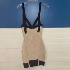 a women's dress hanging on a blue and white wall