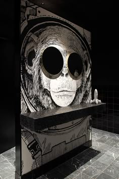 an artistic display in the shape of a skull with large round glasses