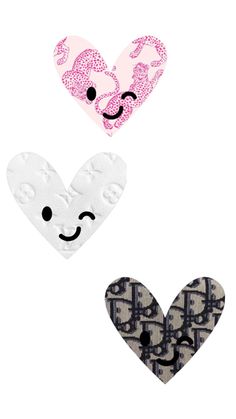 three heart shaped patches with faces on them