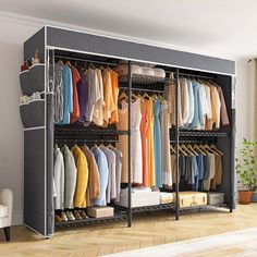 an open closet with clothes and shoes on it in a living room next to a window