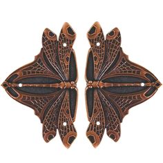 two brown and black butterfly shaped brooches on white background with clipping to each side