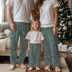 Cozy Christmas matching family pajama pants for men, women, and kids.  Super soft feel with an elastic waistband and hand drawn Christmas art, they are the perfect gift under 50. Product features - 100% Polyester for durability and quick drying - Soft hand-feel and smooth printing canvas - Elastic waistband for comfort - Printed-in size and care label for convenience - Assembled in the USA from globally sourced parts Care instructions - Do not dryclean - Do not iron - Tumble dry: low heat - Do not bleach - Machine wash: cold (max 30C or 90F) Matching Pajama Pants, Hand Drawn Christmas, Family Pjs, Matching Pajama, Christmas Matching, Pajamas Gift, Matching Family Pajamas, Matching Pajamas, Family Pajamas