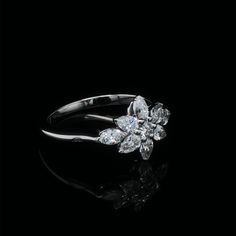 a diamond ring on a black background