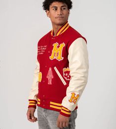 Miami Heritage Varsity Bomber Jacket In Red Unleash vibrant style with the miami heritage varsity bomber jacket. Crafted from premium wool with a quilted inner shell, it offers both warmth and trendiness. The Miami Heritage Edition detailing adds an exclusive touch. Snap button closure, rib-knit collar and cuffs, and two side pockets combine for a classic varsity look. Make a statement in bold red. Outer Shell: Wool Inner Shell: Quilted Feature: Miami Heritage Edition Closure Style: Snap Buttons