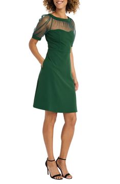 Illusion panels bring sultry style to a timeless little dress that's essential in your wardrobe. 39 1/4" length (size 6) Crewneck Short sleeves 96% polyester, 4% spandex Dry clean Imported Model stats: 5'10" height, 32" bust, 25" waist, 36" hip. Model is wearing size 6. Fitted V-neck Dress With Illusion Neckline, Fitted A-line Dress With Sheer Bodice, Fitted Sheer Green Mesh Dress, Fitted Green Sheer Mesh Dress, Green Fitted Sheer Mesh Dress, Formal Fitted Mini Dress With Sheer Bodice, A-line Dresses With Sheer Bodice And Fitted Design, Spring Mini Dress With Sheer Sleeves And Fitted Bodice, Fitted Dress With Mesh Sleeves For Date Night