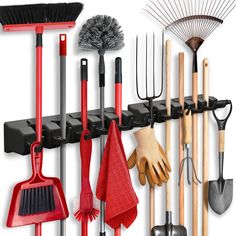 there are many different tools hanging on the wall and in front of it is a rack with brooms, rakes, gloves, and other items