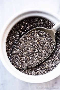 a white bowl filled with chia seeds and a spoon