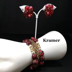 *Description: This is a beautiful Kramer red bracelet and clip earrings from the late 1940s to early 1950s. I tested the gold on the bracelet and it tested at 22K gold surface metal. The red beads are molded so they would be made of thermoset and they have gold glitter inside in places. There are two twisted gold beads with faux pearls on each side, three rows of gold chain on the bracelet with two rows of red art beads. The earrings have matching red solid beads with the same tones and are sign Vintage Red Bracelets For Party, Red Vintage Party Bracelets, Mid-century Red Jewelry For Gift, Mid-century Handmade Wedding Jewelry, Formal Earrings, Red Bracelet, Book Pieces, Red Beads, Red Bracelets