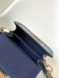 This Dauphine small handbag is made of classic logo denim to show the relentless pursuit of sustainable denim craftsmanship, and convey the atmosphere of neo-retro together with the cow leather trim. An optional chain and interior compartment add functional details.

Dimensions: 20 x 15 x 9 cm (length x height x width) High-end Blue Box Bag For Daily Use, Designer Blue Square Satchel, High-end Blue Box Bag For Everyday Use, Luxury Blue Square Shoulder Bag, Monogram Canvas Shoulder Bag With Metal Hardware, High-end Blue Top Handle Box Bag, High-end Blue Box Bag With Detachable Handle, Everyday Monogram Canvas Shoulder Bag With Metal Hardware, Luxury Blue Square Satchel