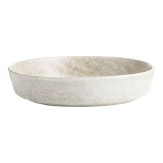 a white bowl sitting on top of a table