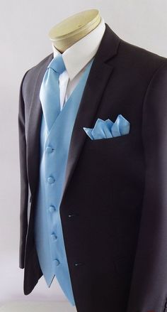 a mannequin wearing a black suit and blue tie