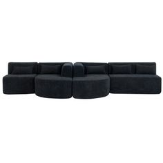 a black sectional couch sitting on top of a white floor