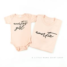 two pink onesuits with black writing on them that say, another girl and another little mama shirt shop