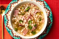 a bowl of soup with ham and beans