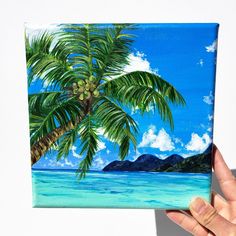 a painting of a palm tree on the beach