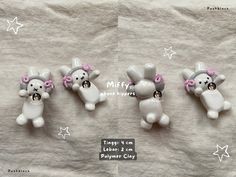 four small white bears with pink bows on their ears