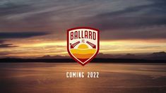 the logo for ballard is shown in front of an orange and red sunset over water