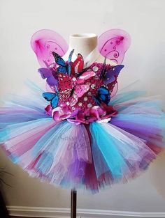 This tutu dress is handmade 100% . It features a stretchy bodice, Rhinestones accents. Perfect for Valentine's Day, pageants, birthdays, holidays, dress up, etc. Embellished Tulle Princess Dress For Fancy Dress, Princess Embellished Tutu Dress For Party, Princess Style Embellished Tutu Dress For Party, Fitted Fairy Kei Dress For Party, Embellished Fitted Tutu Dress For Party, Fitted Embellished Tutu Dress For Party, Fairytale Tulle Fairy Dress For Costume Party, Tulle Fairy Dress For Fancy Dress Occasions, Princess Style Fitted Fairy Dress For Pageant