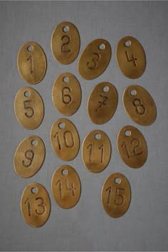 brass numbers and numerals are laid out on a table