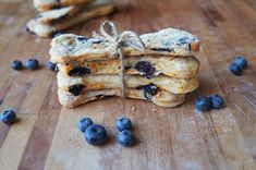 some blueberries are tied up and stacked on top of each other