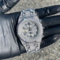 Step into elegance with this iced-out diamond timepiece that mirrors genuine luxury watches. We utilize premium simulated diamonds crafted from high-refractive crystals, ensuring a sparkle that rivals authentic diamonds under the light! INCLUDES AN EASY-TO-USE SIZE ADJUSTMENT TOOL Specifications: - Gender: Men's  - Case Size: 43mm - Movement: Quartz Movement - Battery: Included - Sizing: 8.5-inch band - Adjustable: Links are removable to fit your wrist - Back: Stainless Steel - Lock: Fold-over Clasp - Stone: VVS Diamond Simulate - Case Material: Alloy - Finish: Gold/Silver Plating  Whether you're dressing up for casual days, events, or gifting someone special on occasions like Graduations, Valentine's Day, Anniversaries, Birthdays, Thanksgiving, Christmas, New Year, or Father's Day, this w Silver Diamond Watch With Subdials And Cubic Zirconia, Silver Watch With Cubic Zirconia And Subdials, Silver Cubic Zirconia Watch With Subdials, Luxury Stainless Steel Watches With Diamond Accents, Luxury Silver Stainless Steel Diamond Watch, Luxury Silver Diamond Watch In Stainless Steel, Luxury Silver Chronograph Watch In Stainless Steel, Luxury Silver Stainless Steel Chronograph Watch, Iced Out White Gold Jewelry With Round Dial