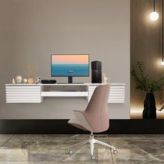 a computer desk with a monitor and speakers on it