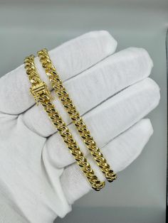 Texas Jewelers Is Presenting You with This Absolutely Stunning Real 14k Pure Yellow Gold Royal Miami Cuban Link Chain 6mm, 22" Inches Long Necklace. The links are 14K PURE GOLD and have a Lobster lock on chain. These Beautiful chain will not tarnish, discolor, or fade because they are Pure 14k Yellow Gold. All our item is hand designed in Grapevine Texas USA. Metal Purity: 14k Pure Yellow Gold  Weight: (21-25) Grams (Approx) Length: 22" inch Long Width of Chain: 6 mm (Approx.) Lock Type: Box Loc Classic Diamond Cuban Link Necklace As A Gift, Luxury Cuban Link Necklace With Vvs Clarity, Luxury Cuban Link Necklace With Vvs Clarity As Gift, Formal Cuban Link Necklace With Curb Chain, Polished Finish Cuban Link Necklace Gift, Classic Formal Cuban Link Necklace, Luxury 14k Gold Cuban Link Necklace With Box Chain, Luxury Jewelry With Curb Chain, Luxury Cuban Link Necklace With Box Chain As Gift