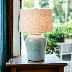 Aqua Reactive Glaze Stoneware Table Lamp with Linen Shade - 17-in. x 26-in. - Mellow Monkey 25 Inch Table Lamps, Bedside Lamp Farmhouse, Coastal Table Lamps, Stoneware Lamp, Blue Glass Lamp, Farmhouse Lamp, Lamp Nightstand, Designer Table Lamps, Farm Road