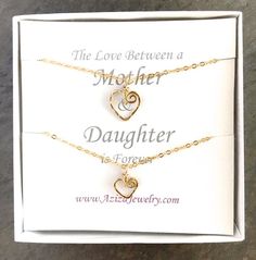 This Gold Hearts Necklace Set is just for your favorite mother-daughter duo. These matching 14k gold filled heart necklaces make the bond between mother and daughter even more special. "The love between a mother and daughter is forever."DETAILS:Two swirly heart necklaces are hand formed from 14k gold filled wire into the shape of hearts and then hammered for texture and shine. The larger heart measures about 1/2 inch wide while the smaller heart measures a little more than 1/4 inch wide. Each se Heart Charm Necklace For Anniversary And Mother's Day, Heart Charm Necklace For Mother's Day Anniversary, Open Heart Necklace For Anniversary And Mother's Day, Double Heart Necklace With Heart Charm For Mother's Day, Mother's Day Open Heart Necklace For Anniversary, Heart Pendant Charm Necklace For Anniversary And Mother's Day, Heart Pendant Charm Necklace For Mother's Day Anniversary Gift, Heart Pendant Charm Necklaces For Anniversary And Mother's Day, Double Heart Charm Necklace For Mother's Day Anniversary