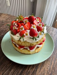 strawberry shortcake with whipped cream and fresh strawberries on the top, ready to be eaten