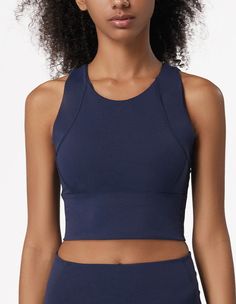 The EMES SHOP sports bra is detailed with a high round scoop neckline. thick tank straps. a built-in lined bra. and cropped fit. Features a thick waistband and acontouring seaming. This light-weight. quick-drying. buttery soft compressing sportsbra features all the support and comfort you need. while still looking cute.MATERIAL:75% Nylon. 25% Spandex MEASUREMENTS:Small : 4-6 Waist: 25-26.5 in Chest: 33-34.5 inMedium : 6-8 Waist: 26.5-28 in Chest: 34.5-36 inLarge : 8-10 Waist: 28-29.5 in Chest: 3 Stretch Sports Bra With Built-in Padding And Tank Straps, Cropped Sports Bra With Built-in Bra For Training, Sports Tank Crop Top With Built-in Bra, Fitted Tank Sports Bra With Built-in Bra, Sleeveless High Stretch Crop Top With Built-in Padding, Cropped Yoga Sports Bra With Built-in Bra, Functional Sleeveless Crop Top With Built-in Bra, Medium Support Sports Bra With Built-in Bra, Stretch Crop Top With Built-in Bra And Wide Straps