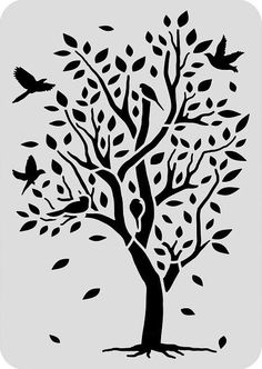 a tree with birds flying around it