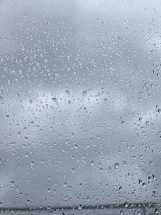 rain drops on the window as it is raining