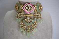 Introducing this intricate piece from our new meenakari collection. Handcrafted to perfection with Tyaani Kundan and meenakari design, This choker set is definitely a uniqueness in itself. The colors are so perfect for any upcoming events. A perfect combination of Mint, baby pink and gold. Such a beauty!! ALL SALES ARE FINAL!! KINDLY MESSAGE ME IF YOU HAVE ANY QUESTIONS. Festive Meenakari Chandbali Choker, Traditional Meenakari Choker For Festive Season, Festive Meenakari Choker, Bollywood Style Meenakari Choker For Diwali, Bollywood Meenakari Choker For Diwali, Multicolor Cutdana Choker For Gift, Multicolor Cutdana Choker As Gift, Gift Multicolor Cutdana Choker, Festive Multicolor Cutdana Choker