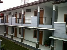 two story apartment building with balconies and balcony