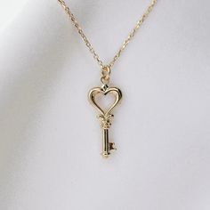 14K gold heart key necklace 14K gold heart key charm is about 18mm x 8.5mm 14K gold 1 mm diamond-cut cable chain All components are 14k gold Elegant Heart-shaped Necklace With Two Keys, Luxury Gold Jewelry With Keys, Gold Heart Necklace With Two Keys, Yellow Gold Key Pendant Jewelry, Elegant Heart-shaped Key Jewelry, Classic Jewelry With Keys For Gifts, Elegant Two Keys Necklace As Gift, Elegant Two Keys Necklace Gift, Elegant Two Keys Necklace For Gift