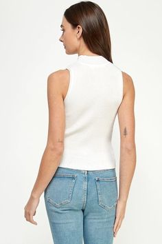 Elevate your style with the Ellison Rib Knit Mock Neck Sleeveless Top. This versatile tank top adds texture and flair to any outfit. The mock neck and sleeveless design give it a modern touch, while the semi-cropped hem adds a playful twist. A must-have staple in your wardrobe! Knit Turtleneck Tank Top, High Neck Knit Tank Top, Chic Knit Turtleneck Tank Top, Chic Turtleneck Knit Tank Top, Knit High Neck Tank Top, Spring Turtleneck Knit Tank Top, Knit Turtleneck Tank Top For Spring, Versatile Sleeveless Mock Neck Top For Spring, Ribbed Knit High Neck Tank Top