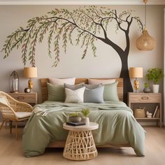 a bedroom with a large tree painted on the wall above the bed and two wicker chairs