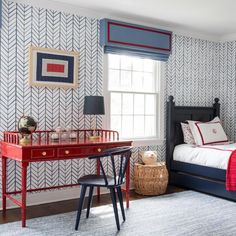 a bedroom with red, white and blue decor