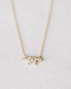 This stunning Gold Crystal Flower Necklace is crafted from gold vermeil with a beautiful crystal flower. measures 17.75" at longest, 15.75" at shortest Elegant Rose Gold Crystal Necklace With Delicate Chain, Elegant Gold Crystal Necklace For Wedding, Gold Plated Flower Pendant Jewelry For Wedding, Elegant Crystal Flower Necklace, Formal Gold Jewelry With Flower Charm, Gold Plated Flower Shaped Wedding Necklaces, Elegant Gold Crystal Necklaces, Gold Plated Flower Shaped Necklace For Wedding, Elegant Gold Flower Pendant Jewelry