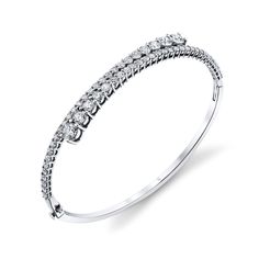 Elevate your wrist game with our exquisite Diamond Bypass Bangle Bracelet, an emblem of luxury and sophistication. This bracelet showcases round diamonds meticulously set in a stunning bypass design, radiating timeless beauty Elegant Vvs Clarity Diamond Bangle Bracelet, Fine Jewelry Jubilee Bracelet In Diamond White, Luxury Diamond Bangle Bracelet With Prong Setting, Modern Diamond White Tennis Bangle Bracelet, Dazzling Diamond Bangle Bracelet For Formal Occasion, Timeless Diamond White Bangle Bracelet, Fine Jewelry Jubilee Bracelet In White, Timeless Brilliant Cut Diamond Bangle Bracelet, Exquisite Formal Bangle Diamond Bracelet