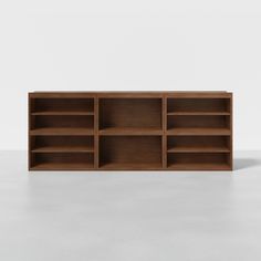 an empty wooden shelf with several shelves on each side and no one in the room