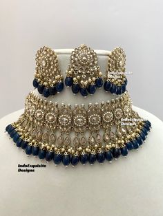 Antique Gold Polki Necklace Set comes with Stud earrings and tikka / Indian Jewelry/ High Quality Kundan and Polki Jewelry/ Bollywood Jewelry/Wedding Jewelry/Navy Blue  All items are shipped from Brampton, Ontario, Canada. If you need your item by a certain day, please reach out to us for express delivery option before placing the order so that we can update the shipping for you. Standard shipping/delivery timeline Below are the delivery timeline estimates once the order ia shipped ---> USA delivery timeline * 3-5 business days to major urban centers in USA. It may take 1-2 days extra to remote locations ---> Canada delivery timeline  * 2-3 business days - GTA  & Montreal  * 2-4  business days - Rest of Ontario/Quebec * 3-6 business days-  Rest of Canada    ---> Europe/Middle East timeline Party Jewelry With Zari Work For Festivals, Bollywood Blue Bridal Necklace Hand Set, Blue Kundan Necklace For Celebration, Blue Stone Work Jewelry For Celebration, Blue Hand-set Bridal Necklace For Celebration, Blue Hand Set Bridal Necklace For Celebration, Blue Bridal Necklace Hand Set For Celebrations, Celebration Blue Bridal Necklace Hand Set, Festive Blue Kundan Necklace With Cutdana