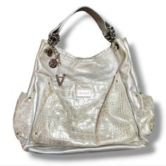 Versace Chain Shoulder Bag Silver Metallic Croc Patterned Leather Large Size 100% Authentic Versace Chain Purse In Very Good Pre-Owned Condition, Please See Pictures For Normal Wear / Marks. Buttery Soft Leather Chain / Rivet Detail On The Handle Medusa Grommet & Classic Versace V Grommet Croc Leather On The Pockets Sparkly Silver Metallic Leather Larger Sized Y2k Style Shoulder Bag Purse Measurements (Flat Lay) Hight: 15" Width: 15" Across The Bottom: 4.5" Strap Drop: 8" **Fast Shipping! Versace Chain, Silver Handbag, Chain Purse, Bag Silver, Versace Bags, Croc Leather, Metallic Bag, Chain Shoulder Bag, Leather Chain